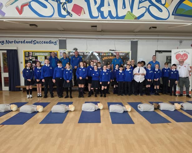 Heart of Foyle volunteers with pupils from St Paul's Primary School in Galliagh.