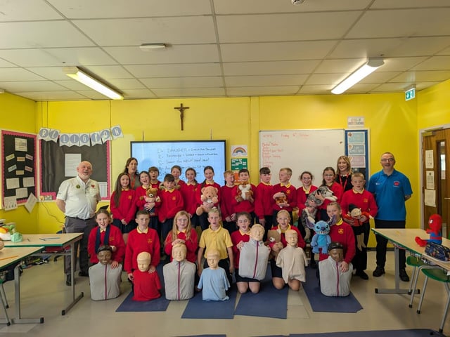 Children from Steelstown Primary School with Heart of Foyle volunteers on Restart a Heart Day.