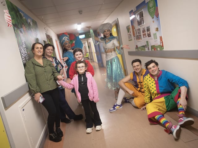 Characters from 'Aladdin' the 2024 Christmas Pantomime at the Millennium Forum pictured with staff during a visit to the Children's Ward at Altnagelvin Hospital on Thursday afternoon. Included with the panto characters are Clodagh Doherty with her mum Claragh and mum Karinne. Second from left is Cathy Grady, Children's Ward, Altnagelvin Hospital.
