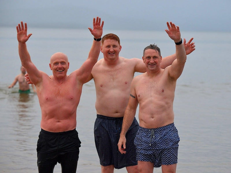 Swimmers brave the elements to take part in the annual Christmas morning charity swim at Ludden beach. Photo: George Sweeney. DER2252GS – 24