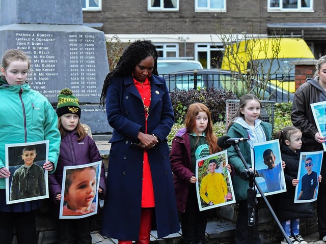 Mayor Lilian Seenoi Barr stands alongside young relatives of those murdered on Bloody Sunday during the one minute silence dedicated to the children of Gaza at the Bloody Sunday monument on Thursday afternoon. Photo: George Sweeney
