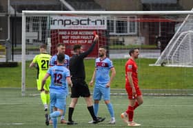 Referee Ryan Hanna sends off Institute’s Danny Lafferty, in the fifth minute, for a foul on Portadown’s Eamon Fyfe. Photo: George Sweeney