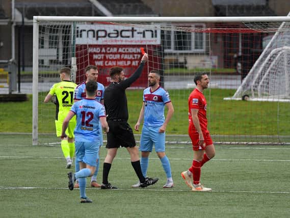 Referee Ryan Hanna sends off Institute’s Danny Lafferty, in the fifth minute, for a foul on Portadown’s Eamon Fyfe. Photo: George Sweeney