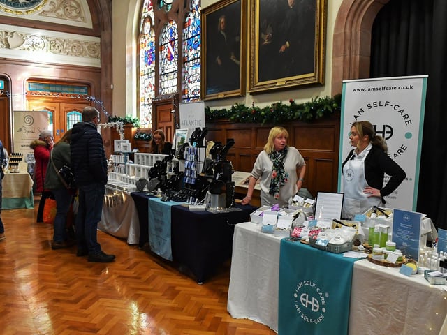 People browse the large range of gifts at the Guildhall Christmas Fair on Friday afternoon. Photo: George Sweeney / Derry Journal