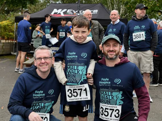 Daire Duffy (centre) raised £1000 in sponsorship the Foyle Hospice. Included in the photos are Niall Gillespie and Chris Sharkey. Photo: George Sweeney