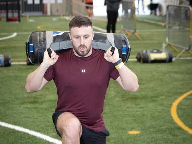 Aaron Boyle on the Sandbags Lunge during Sunday's Tri-Rox competition in Creggan. (Photos: Jim McCafferty Photography)