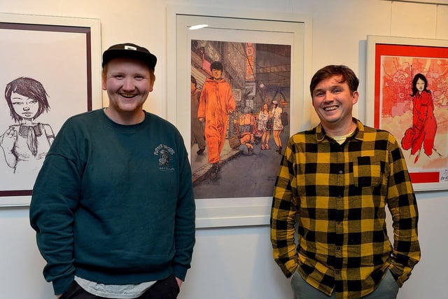 Street Artist and illustrator Elph One aka Brian McFeely ( right) pictured UV ARTS director Karl Porter at the launch of his ‘Doodles in Derry’ exhibition on Saturday in the UV Arts ‘The Urban Art Gallery’ in Bishop Street.  Photo: George Sweeney. DER2301GS – 58