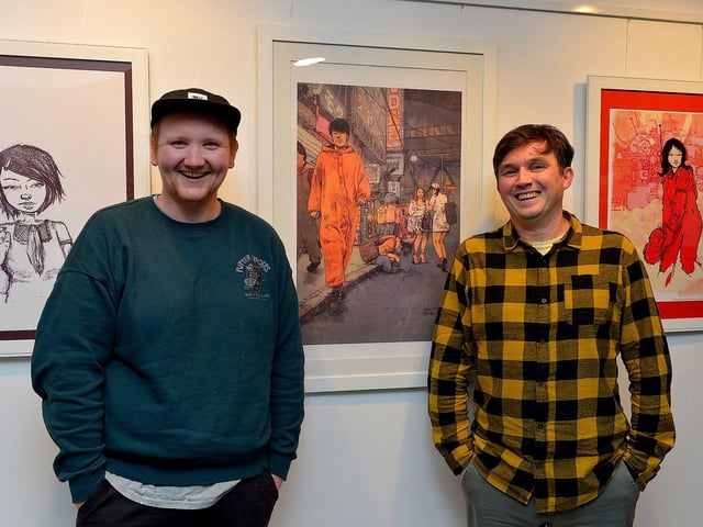 Street Artist and illustrator Elph One aka Brian McFeely ( right) pictured UV ARTS director Karl Porter at the launch of his ‘Doodles in Derry’ exhibition on Saturday in the UV Arts ‘The Urban Art Gallery’ in Bishop Street. Photo: George Sweeney. DER2301GS – 58