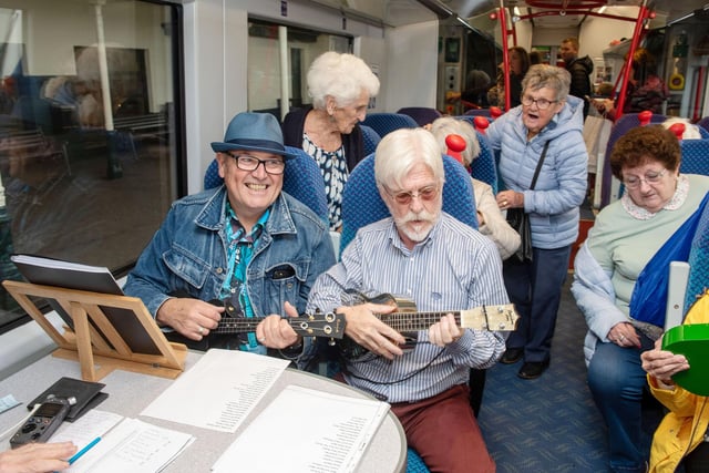 Members of U3A Ukulele Band entertain passengers on the first Chat Tea Train event