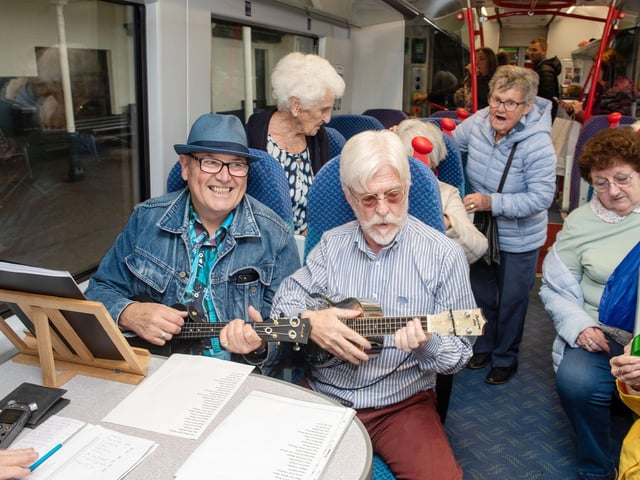 Members of U3A Ukulele Band entertain passengers on the first Chat Tea Train event