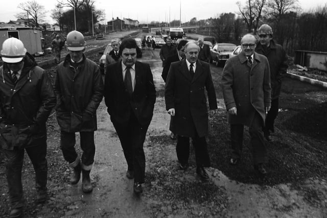 SDLP Leader John Hume with construction firm representatives and dignitaries during a visit by the European Commissioner for European Commissioner for Taxation, Consumer Affairs, Transport and Parliamentary Relations, and Inter-institutional Relations and Administration, Richard Burke.