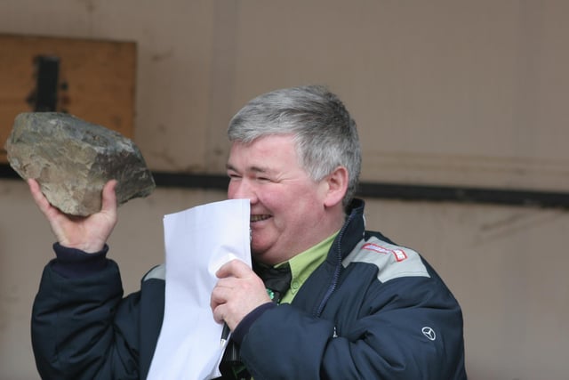 Parade MC Colr. Nicholas Crossan caught between a rock and a...... (1803C11) : St Patrick's Day Buncrana 2005.