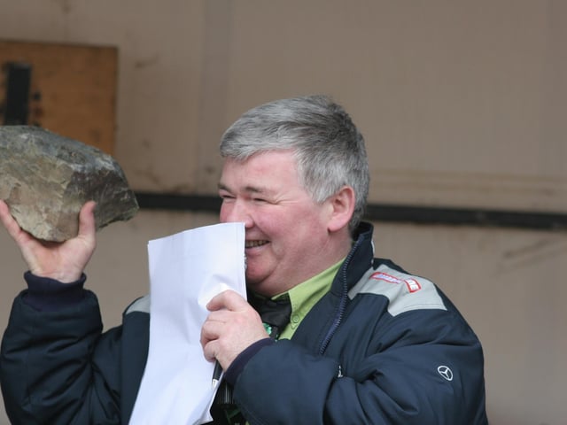 Parade MC Colr. Nicholas Crossan caught between a rock and a...... (1803C11) : St Patrick's Day Buncrana 2005.