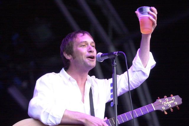 Simon Fowler toasts the crowd.