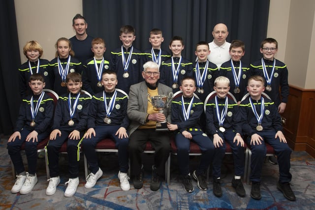 John ‘Jobby’ Crossan pictured with the Sion Swifts 2011 team who were Premier League winners, Summer and Winter Cup runners-up, during the Annual Awards in the City Hotel on Friday night last. Included are coaches Adam Buchanan and Michael Mullan.