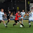 Shelbourne pair Shane Farrell and Kameron Ledwidge close in on Derry City’s Paul Mullan.. Photo: George Sweeney