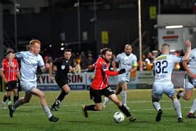 Shelbourne pair Shane Farrell and Kameron Ledwidge close in on Derry City’s Paul Mullan.. Photo: George Sweeney