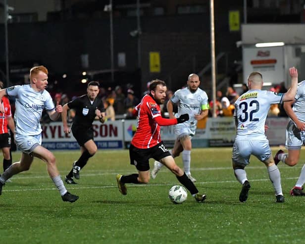 Shelbourne pair Shane Farrell and Kameron Ledwidge close in on Derry City’s Paul Mullan.. Photo: George Sweeney