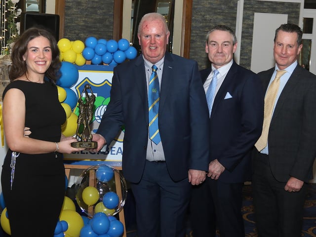 Hannah McDermott, Senior LPGA Player of the Year 2024 receives her trophy from Liam Gallagher, Club Chair. Included on right are Ciaran McLaughlin, Outgoing Ulster President, and Cormac Hartnett, County Board Hurling Officer.