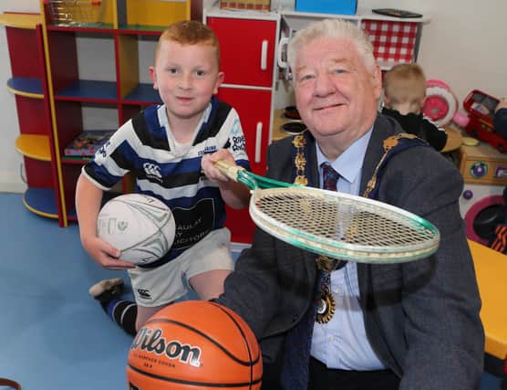Ruairi McLaughlin with the Mayor, Councillor Steven Callaghan at the unveiling of the new multi-use games area at Magilligan Community Centre.