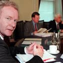 Martin McGuinness with First Minister David Trimble and Deputy First Minister Seamus Mallon in 2000. (Photo by PAUL FAITH/POOL/AFP via Getty Images)
