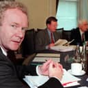 Martin McGuinness with First Minister David Trimble and Deputy First Minister Seamus Mallon in 2000. (Photo by PAUL FAITH/POOL/AFP via Getty Images)