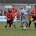 Derry City‘s Adam O’Reilly and Ronan Boyce tackle Shelburne’s Mark Coyle. DER2321GS - 