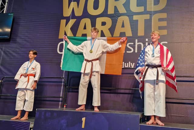 Derry's PJ Moynihan celebrates his gold medal performance in kata on the podium in Dundee.