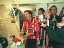 Liam Coyle celebrates winning the league title in 1997 - the last time the Candy Stripes lifted the Premier Division trophy.