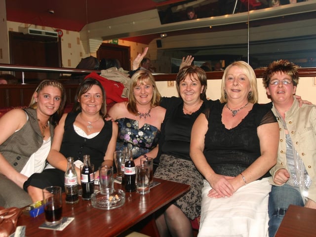 Helen seated with a group of friends at her surprise 50th in the Phoenix. 1212/dd : Parties in December 2005.