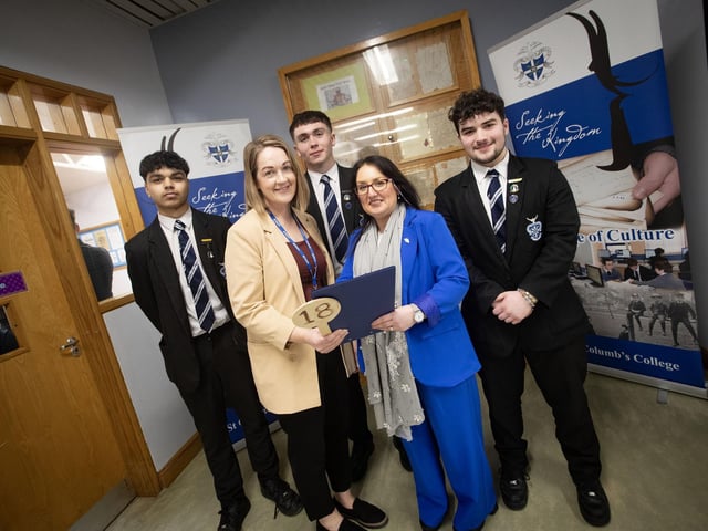TIME CHECK!. . . .St. Columb's College Principal Mrs. Caroline McLaughlin checking how Saturday's Open Day is going with Mrs. McNulty and students Jake, Somhairle and Sean. : .