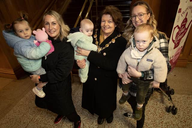 Mums and babies, Sinead O'Kane and Cait, Jessica Clarke and Casey pictured with the Mayor Patricia Logue holding baby Coan during Thursday morning's Breastfeeding in Public Day celebration in the Guildhall, Derry. Photos: Jim McCafferty Photography