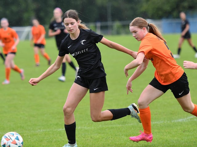 Sierra Hitchcock, Surf Select (USA) and Jessica McBroome, Mid Ulster Ladies Under-15's tussle for the ball.