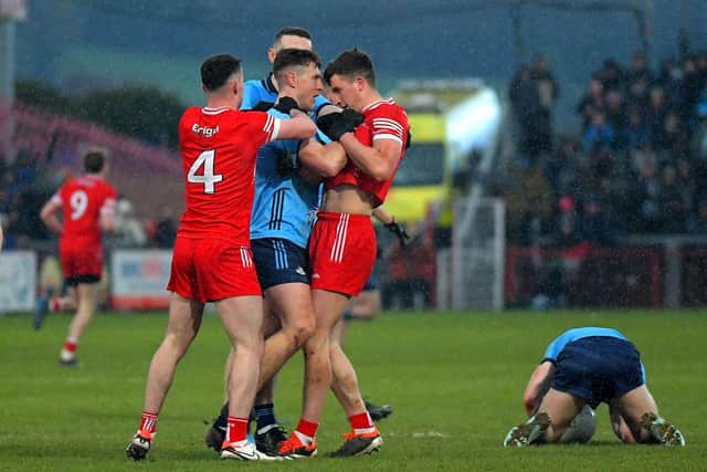 Derry and Dublin players get involved in a scuffle. Photo: George Sweeney