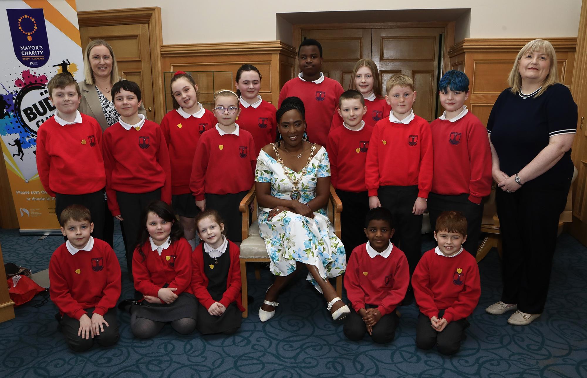 Mayor Lilian Seenoi Barr with student council members from Lisnagelvin PS when they visited the Mayor's Parlour. Included, on Mrs. O'Hara, teacher and on left, Helena Boyle, school secretary.