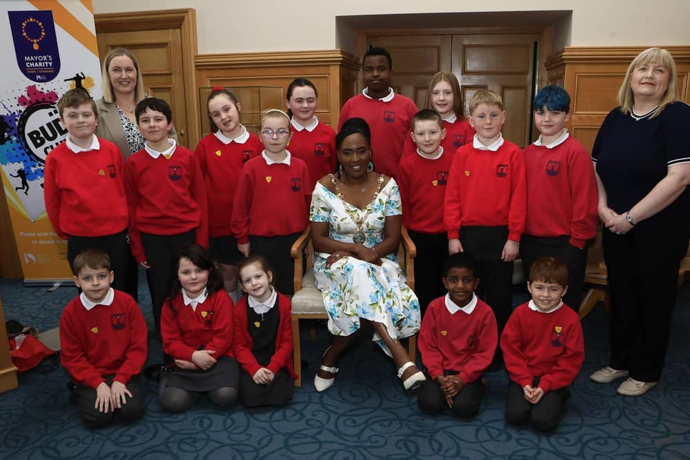Mayor Lilian Seenoi Barr with student council members from Lisnagelvin PS when they visited the Mayor's Parlour. Included, on Mrs. O'Hara, teacher and on left, Helena Boyle, school secretary.