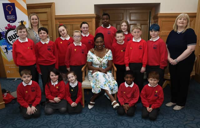 Mayor Lilian Seenoi Barr with student council members from Lisnagelvin PS when they visited the Mayor's Parlour. Included, on Mrs. O'Hara, teacher and on left, Helena Boyle, school secretary.