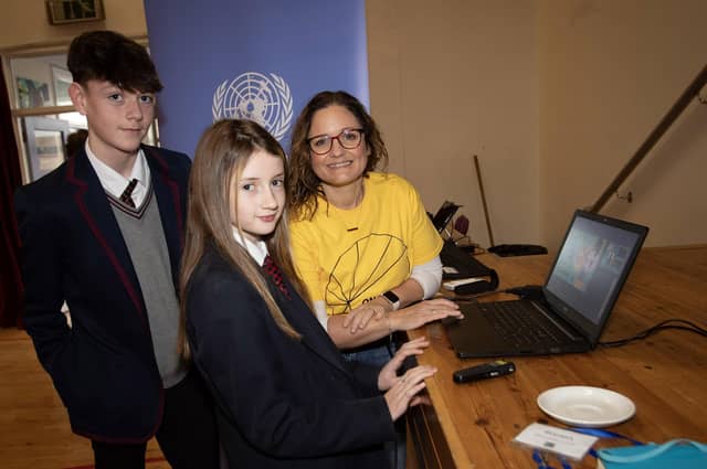 Maria McLaughlin, One World Festival, talking to students Cillian Dorrian and Rihanna Nicholl.