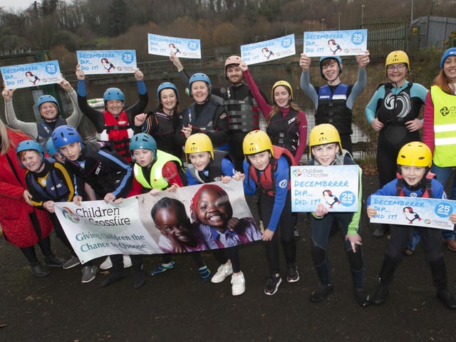 Mrs. Ciara Deane, principal, St. Joseph’s Boys School pictured with her staff and students who took part in the Children in Crossfire Pier Dive at the Creggan Reservoir on Saturday last. (Photos: Jim McCafferty Photography)