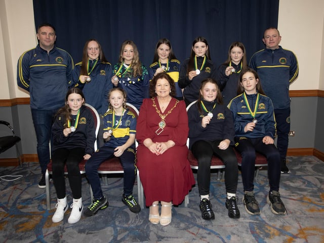 The Mayor of Derry City and Strabane District Council, Patricia Logue pictured with Don Boscos u-12s, runners up in the Winter Cup. Included are coaches Aaron Starrs and Marty Mooney.