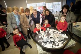 Grannies and grandchildren pose for a picture in the P1 class on Wednesday.