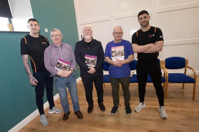 Old Library Trust staff members Pete Simms and Jonathan Peberdy pictured with service users at Tuesday's AGM in Creggan. Spasy McGilloway, Gerry Arbuckle and Bobby Whoriskey.