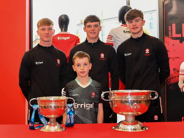 Jack Carney pictured with members of Derry's All-Ireland Minor Champions team at O'Neill's Superstore last week. Photo: George Sweeney