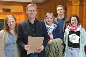 Shaun Harkin with People Before Profit activists handing in his nomination papers at the Guildhall.