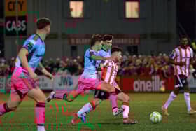 Bohemians players converge on Derry City’s Adam O’Reilly. Photograph: George Sweeney