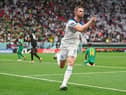 Jordan Henderson of England celebrates after scoring the team's first goal against Senegal at the Al Bayt Stadium. (Photo by Dan Mullan/Getty Images)