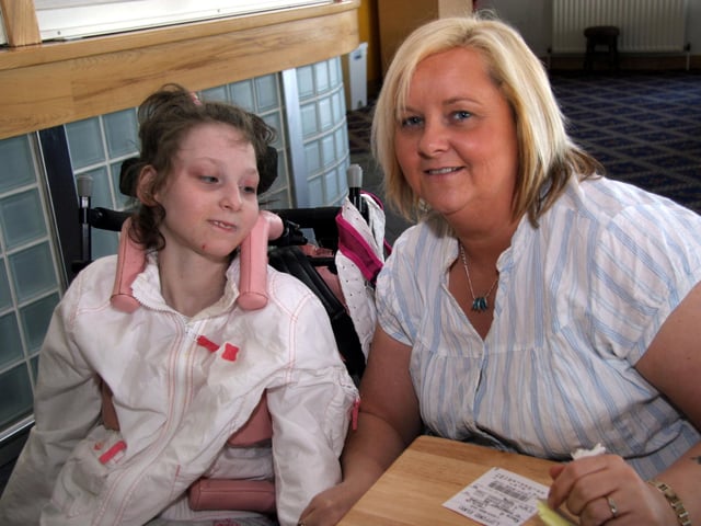Orla O'Kane and Sallyann O'Kane enjoying a day at the dog track 0519JML : Parties and celebrations across Derry in May 2006.