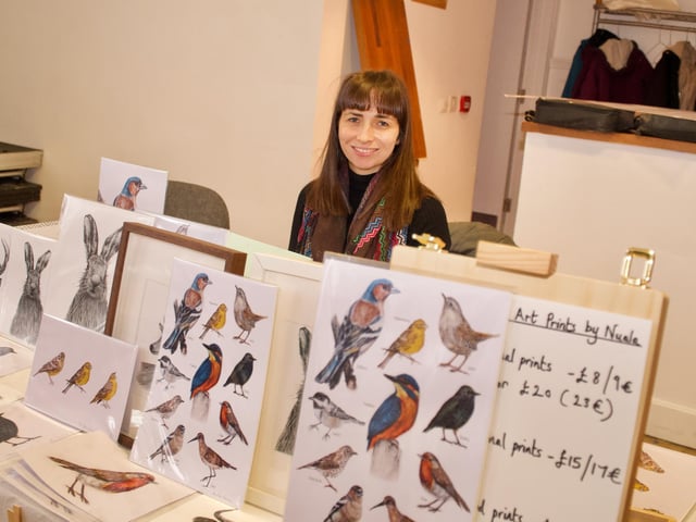 Artist Nuala with some of her works.