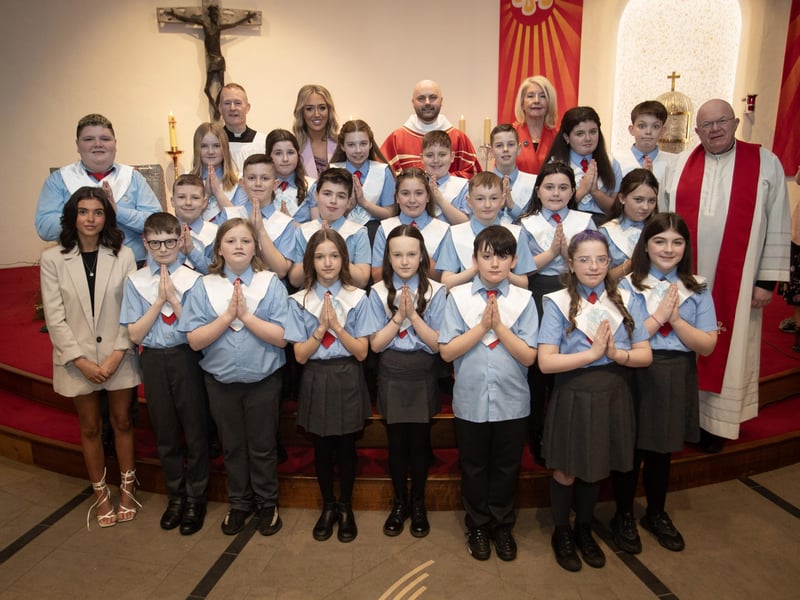 ST. BRIGID'S CONFIRMATION. . . . .Pupils from Miss Laura McLaughlin's class at St. Brigid's Primary School who received the Sacrament of Confirmation from Fr. Chris McDermott at St. Brigid's Church, Carnhill on Thursday last. Included from left are Miss Molly Feeney, Fr. Sean O'Donnell, Ms. Laura McLaughlin, Fr. Chris McDermott, Ms. Mary McCallion, Principal and Fr. Michael McGaughey. (Photos Jim McCafferty Photography)