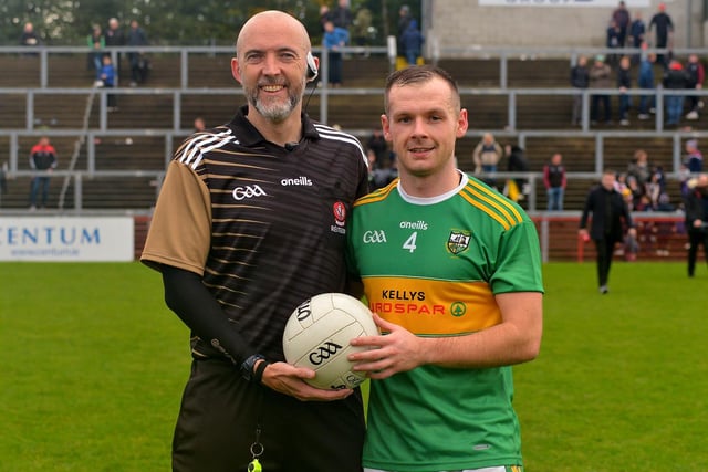 Connor Carville, captain of Watty Graham’s, Glen, presents the match ball to referee Gavin Hegarty at the end of the SFC final on Sunday afternoon, as part of the GAA’s Referee Respect Day. DER2243GS – 021